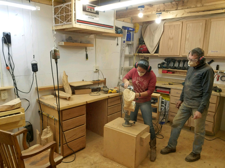 Michaela Ahrendt carving wood with Dave Ahrendt 